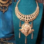 A necklace with a lion head on it