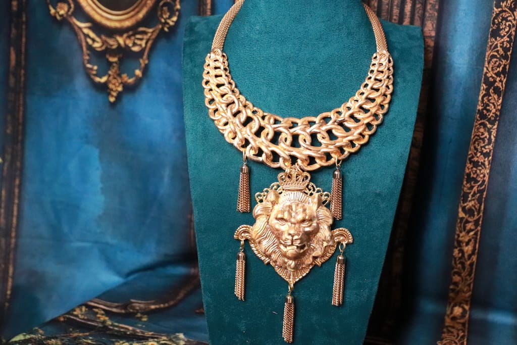 A necklace with a lion head on it