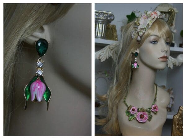 A woman wearing jewelry and earrings with a flower on it.