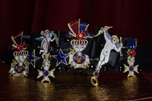 A group of crowns and medals on display.