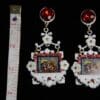A pair of earrings with a picture on them