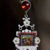 A picture of the back side of a necklace.