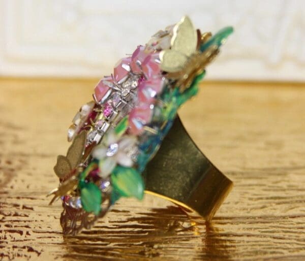 A ring with many different colored stones on it