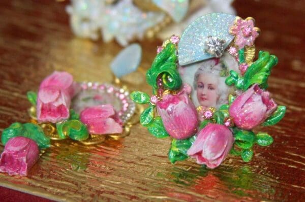 A close up of some pink flowers and a lady