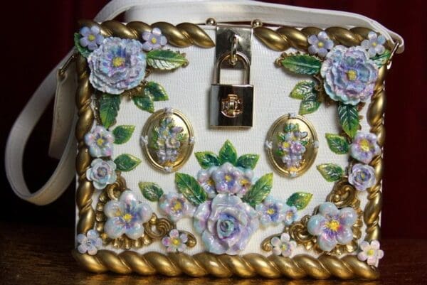 A close up of a purse with flowers on it