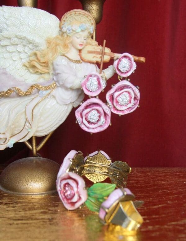 A statue of an angel holding a flower.