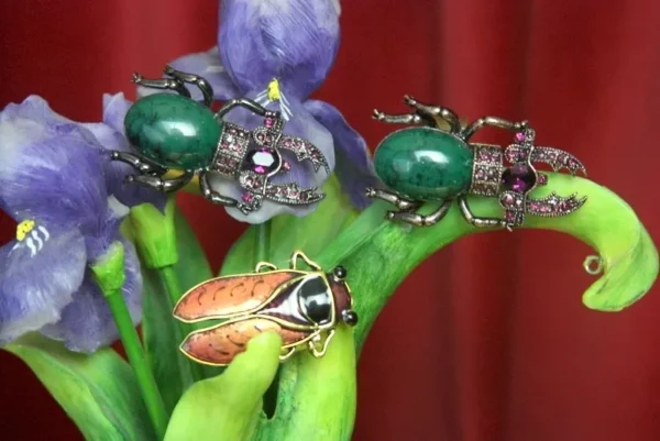 A close up of two bugs on some flowers