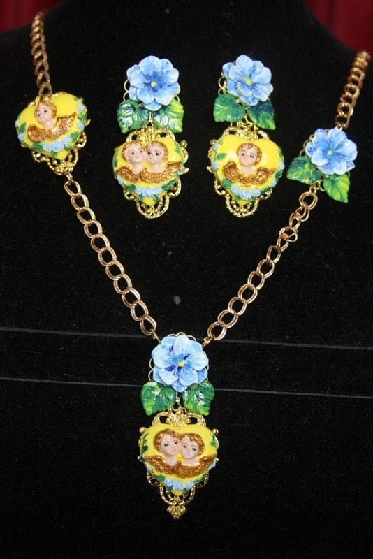 A necklace and earrings set with monkeys on them.