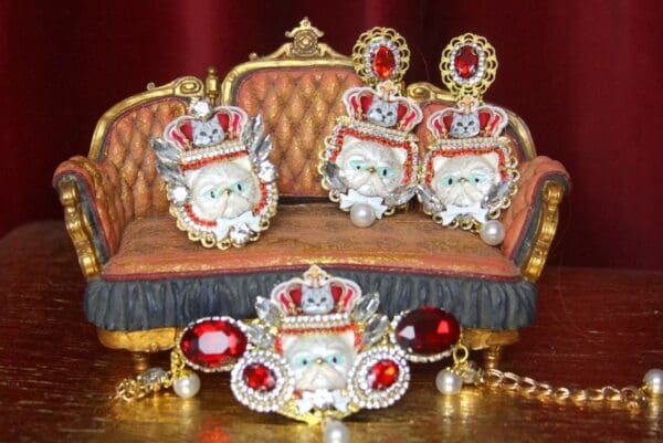 A couch with red pillows and a crown on it