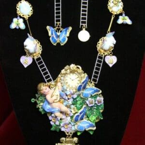 A necklace with a fairy and butterflies on it.