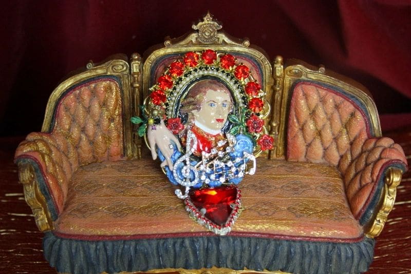 A close up of a chair with a picture on the back