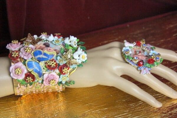 A hand with many different colored flowers on it