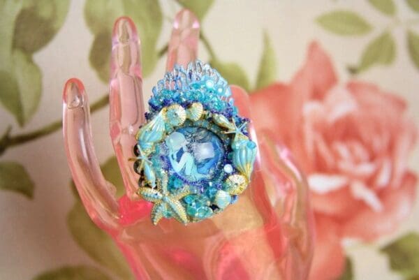 A close up of the ring on a finger