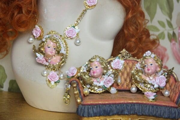 A close up of a doll 's head and necklace