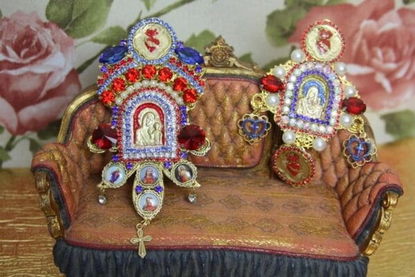 A close up of two chairs with decorations on them