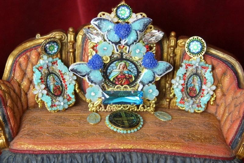 A table with a clock and three pictures on it