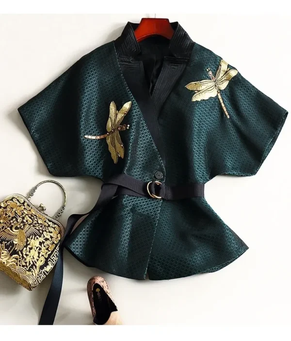 A green jacket with gold dragonflies on it.