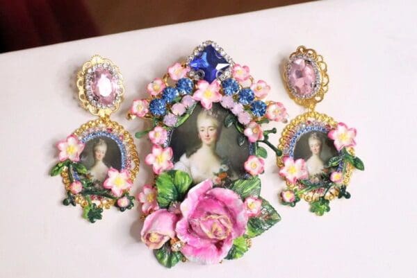 A picture of a woman in a frame with flowers and earrings.