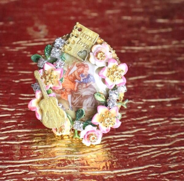 A small figurine of flowers and money on top of a table.