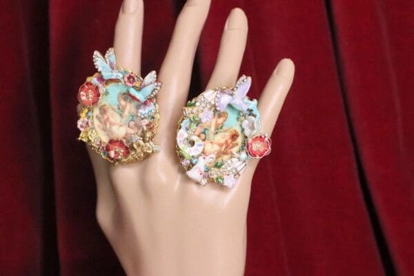 A hand with two rings on it