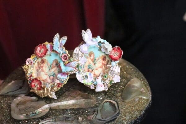 A pair of decorative plates sitting on top of a table.