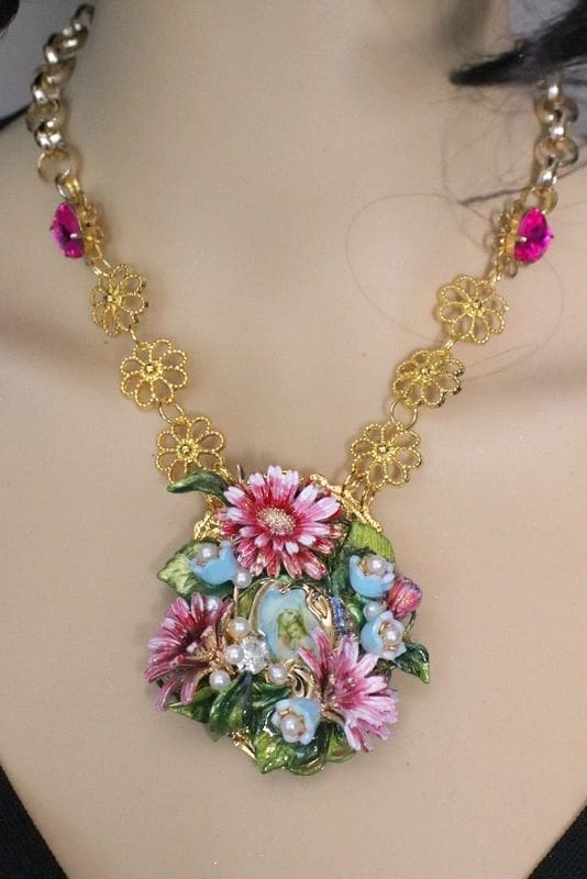 A necklace with flowers and leaves on it