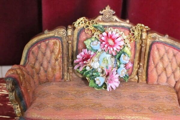A close up of a chair with flowers on it