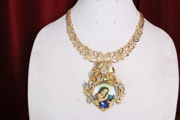 A necklace with a picture of a woman on it.