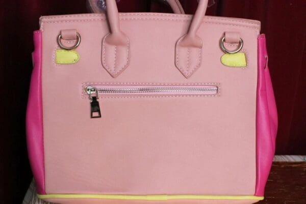 A close up of the inside of a pink purse