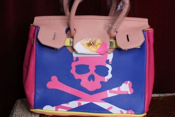 A bag with a skull and crossbones painted on it.
