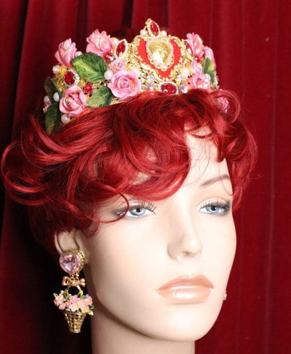 A mannequin wearing a red wig and a floral crown.
