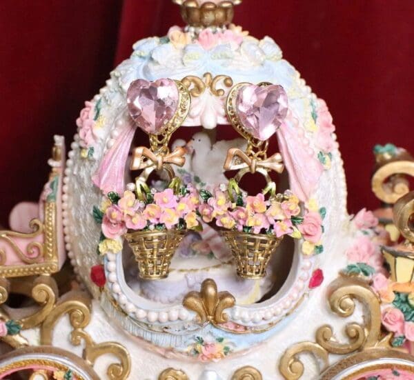 A carousel with two horses and flowers on it.