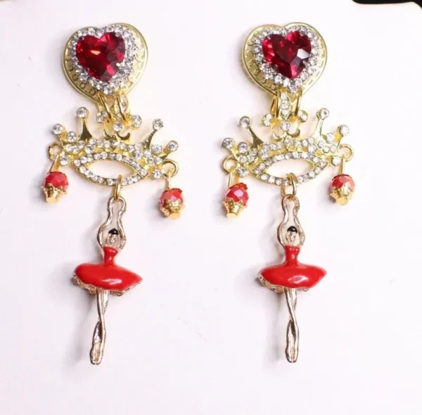 A pair of earrings with red lips and hearts.