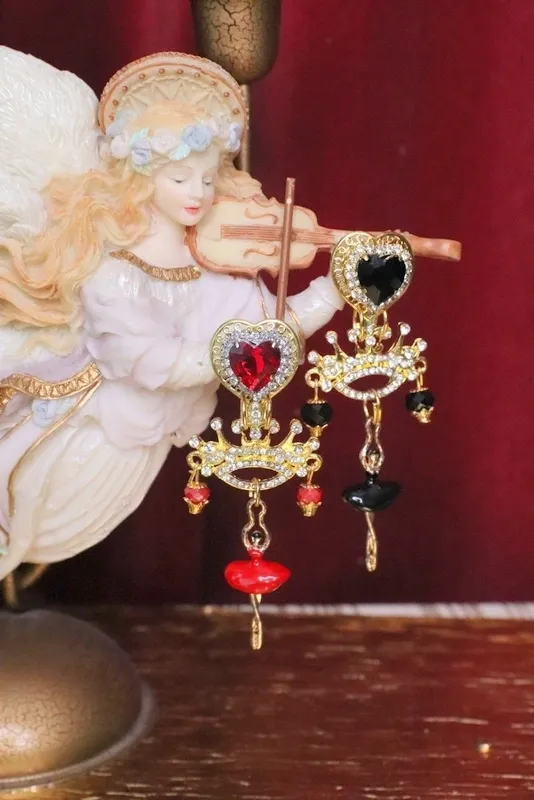 A close up of two earrings on a string