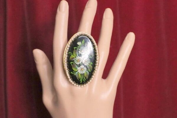 A hand with a ring on it's finger