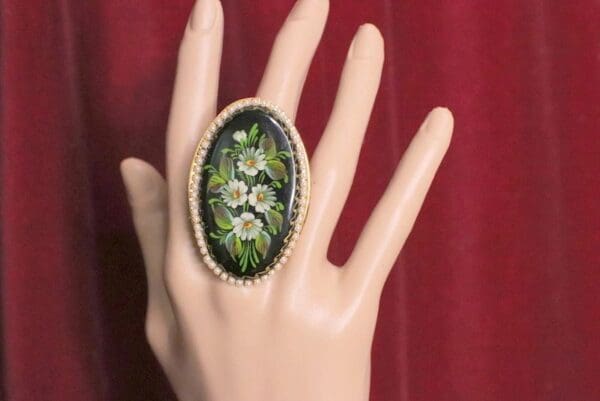 A hand with a ring on it's finger