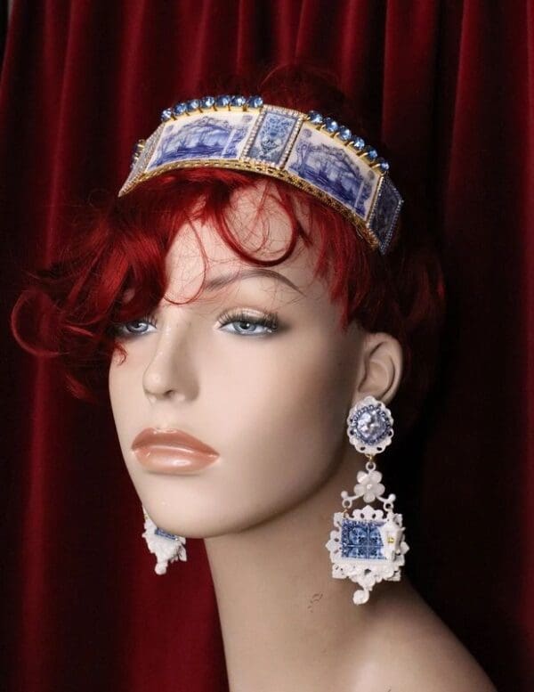 A mannequin wearing a blue and white hat with red hair.
