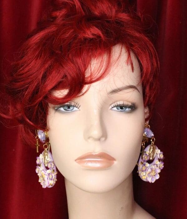 A mannequin with red hair and blue eyes.