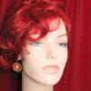 A mannequin with red hair and blue eyes.