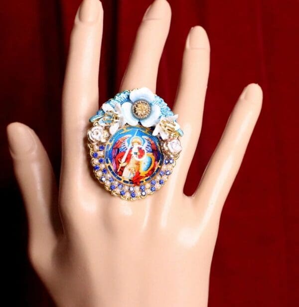 A hand with a ring on it's finger