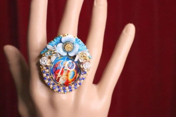 A hand with a ring on it's finger