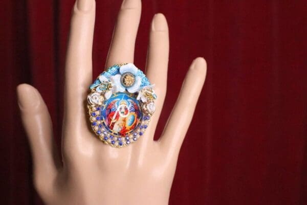 A hand with a ring on it's finger