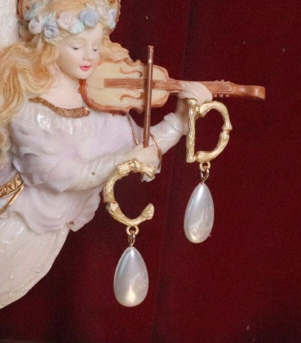 A close up of a figurine with a violin