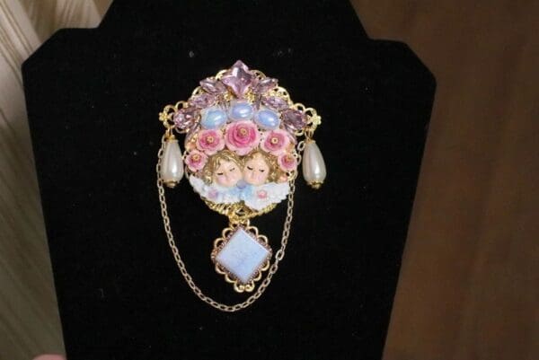 A close up of a brooch on display