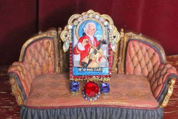 A picture of pope john paul ii is on the back of a chair.