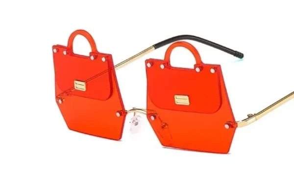 A pair of orange bags with a black handle.