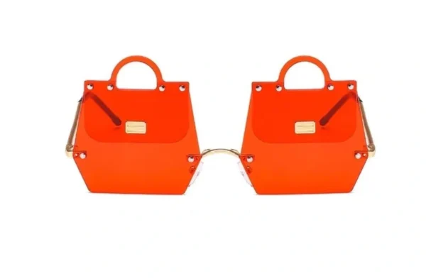 A pair of orange sunglasses with gold frames.
