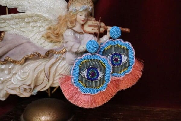 A pair of earrings sitting on top of a table.