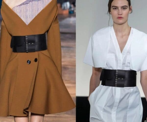 A woman wearing two different belts on one side and another belt with the other.