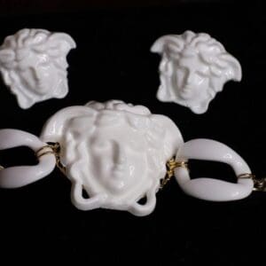A white versace necklace and earrings set.